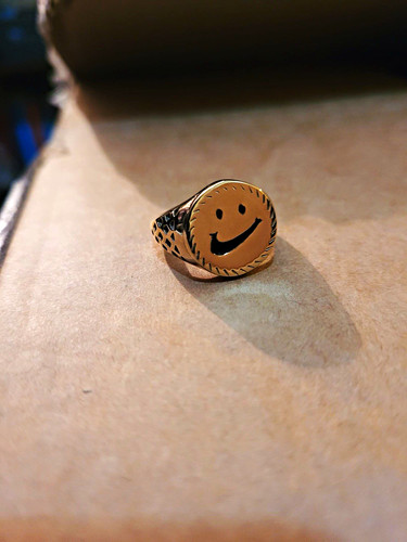 Gold colour smiley face oval - face,